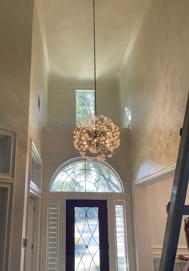 Chandelier installed in a foyer